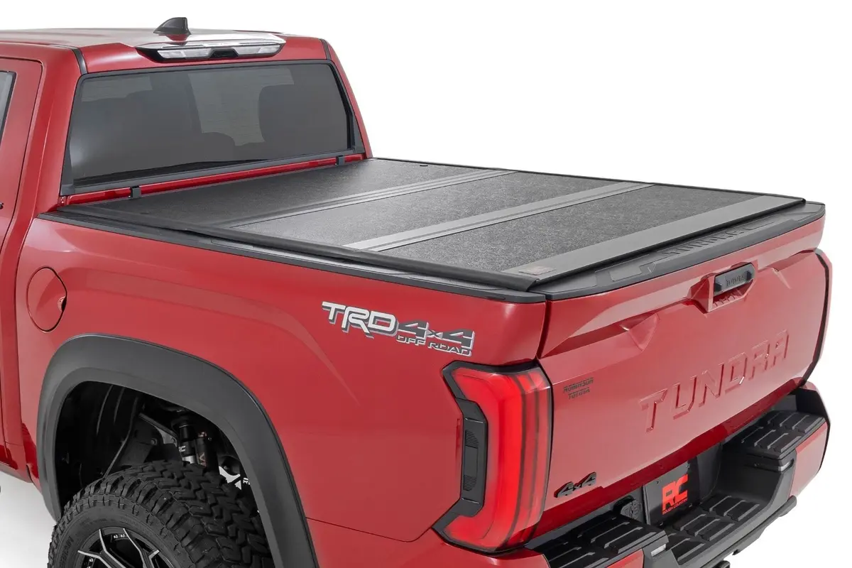 47514551B  -  Hard Low Profile Bed Cover - 5'7" Bed - Cargo Mgmt - Toyota Tundra (22-25) 1