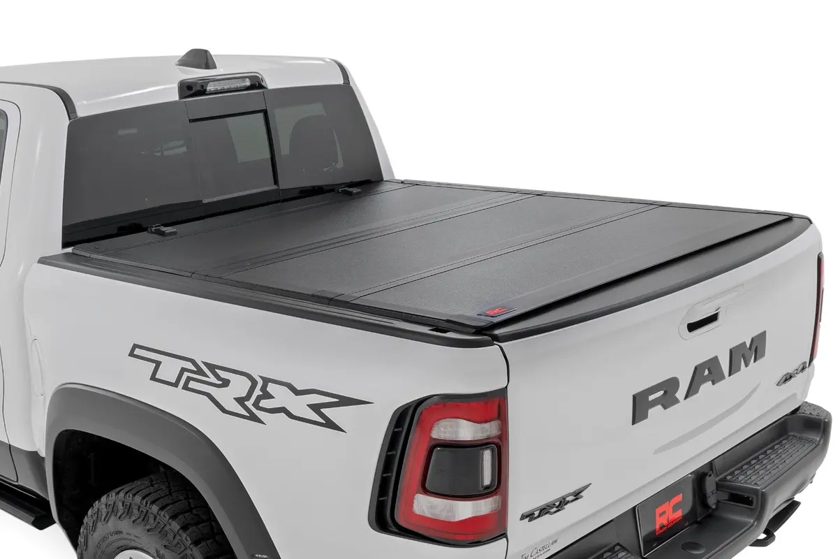 49320650  -  Hard Tri-Fold Flip Up Bed Cover - 6'4" - Ram 1500 (19-25)/1500 Trx (21-24) 1
