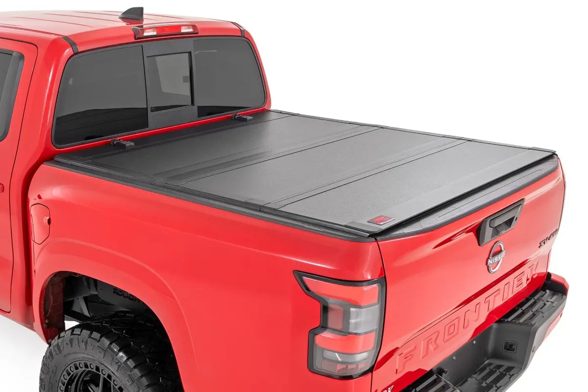 49520551A - Hard Tri-Fold Flip Up Bed Cover - 5' Bed - Nissan Frontier 2Wd/4Wd (22-25) 1